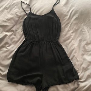 Black short romper with detail on the bottom